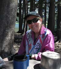 Dianne taking a break from fishing and hiking around Woods Lake