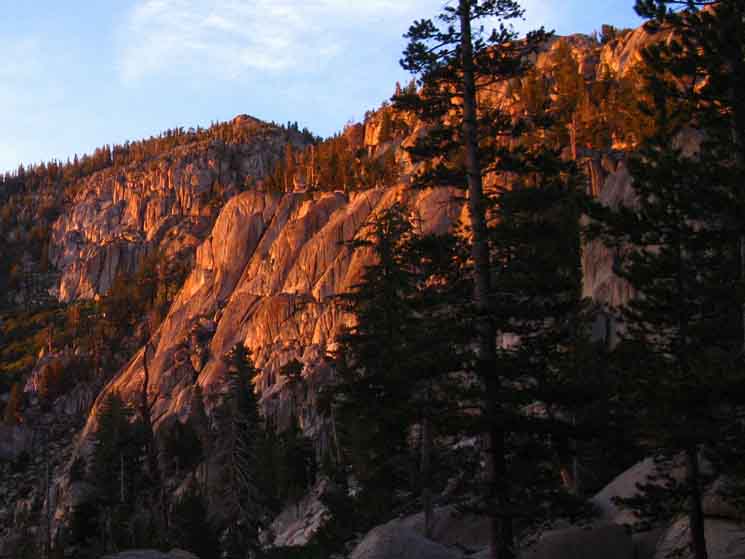 Sunset lights up the cliffs above the North edge of Clarks Fork Meadow.