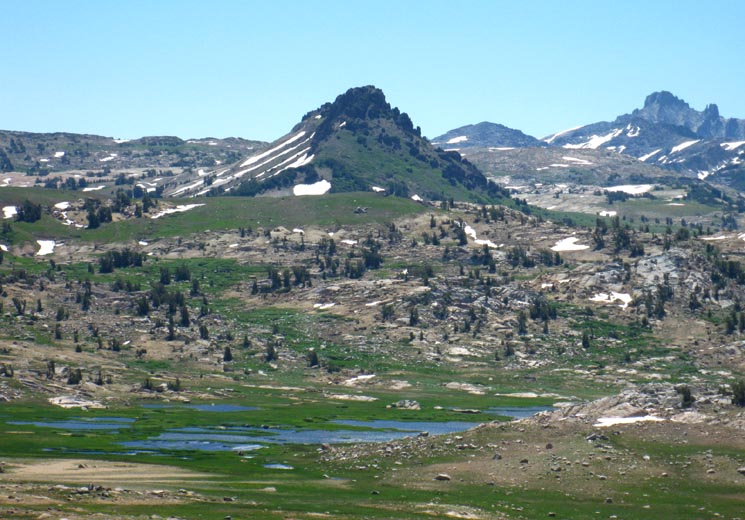 Grizzly Peak beyond Emigrant Meadow Lake with the monster of Tower Peak in the Distance.