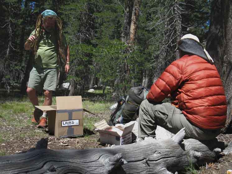 PCT hikers Mover and Parker prepping Tuolumne Meadows resupply packages.